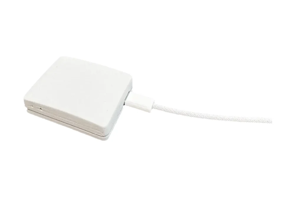 KP-100BT portable air quality sensor with USB-C cable